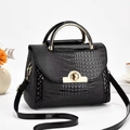 Minimalist black crocodile pattern handbag with gold hardware and removable shoulder strap - Black