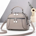 Borsa a conchiglia taupe minimalista con doppia zip e tracolla regolabile - Grigio chiaro
