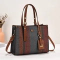 Close-up of tricolor woven canvas tote bag with brown leather straps and metal hardware - One Size / Earthy Yellow