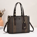 Detail of color-block canvas tote bag with brown leather handles and gold hardware - One Size / Coffee
