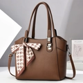 Detail of dark brown lychee textured tote bag with houndstooth silk scarf and silver hardware - Coffee