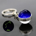 Luminous Aries zodiac glass ball keychain with silver metal ring and glow in the dark effect - Aries