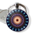 Macro detail of mandala glass cabochon keychain with vibrant symmetrical flower pattern - Deep Indigo Floral (JY006649-6)