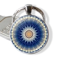 Macro detail of silver mandala keychain with blue geometric pattern and glass dome cover - Dark Blue Beige Kaleidoscope (JY006649-7)