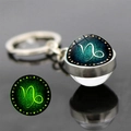 Porte-clés Capricorne lumineux avec pendentif boule de verre brillant double face - Capricorne