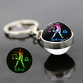 Porte-clés Balance lumineux avec boule en verre de cristal et pendentif phosphorescent - Balance