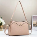 Detail of pink striped crossbody bag featuring floral metal logo and textured finish - Pink