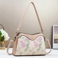 Floral embroidery shoulder bag with pink leather trim and elegant golden hardware - Pink