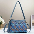 Close-up of color-block embroidered shell pattern on navy leather crossbody bag - L28 W10 H18.5 / Blue