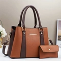 Detail of two-piece tote bag set with brown contrast stitching and gold metal accents - Earthy Yellow