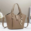 Detail of khaki bucket bag with lychee grain leather and star moon pendant - 28x9x18cm / Khaki