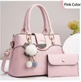 Pink croc-embossed handbag set with gold hardware, metal lock, and plush ball charm - Pink