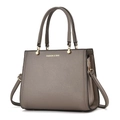 Detail of taupe litchi grain faux leather tote with golden hardware and fashion lettering - 28x12x22cm / Gray