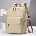 Zaino minimalista in nylon beige con barra metallica e tasche laterali per pendolari - Cachi