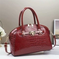 Detail of burgundy crocodile-pattern patent leather handbag with gold metal hardware - 29cmx13cmx22cm / Red