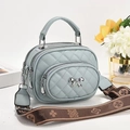Quilted light blue crossbody bag with silver bow and decorative patterned shoulder strap - 20x10x16cm / Mint Green