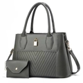 Detail of grey quilted tote bag set with golden padlock and detachable shoulder strap - Gray