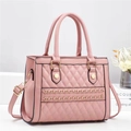 Pink quilted leather handbag with gold chain detail and adjustable shoulder strap - Pink