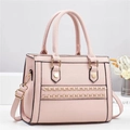 Pink lychee texture handbag with gold chain detail and adjustable shoulder strap - Pink