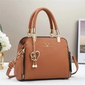 Brown lychee texture handbag with golden hardware and heart pearl pendant detail - Earthy Yellow