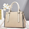 Detailed macro view of cream handbag featuring geometric print and metallic zipper accents - L32 W14 H23 / Creamy White Rhombic