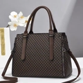 Detailed close-up of a retro brown crossbody bag with beige diamond lattice patterns - L32 W14 H23 / Coffee Argyle