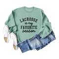 Sage green lacrosse sweatshirt styled with blue jeans and white canvas sneakers - S / Light Green Sweatshirt (Black Font)