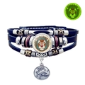 Close-up of leather zodiac bracelet featuring Leo lion charm and green luminous effect - Leo
