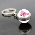 Close-up of pink ribbon breast cancer awareness symbol inside glass keychain pendant - Butterfly Ribbon (JY007298-13)