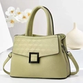 Detail of light green faux leather tote with V-pattern stitching and black matte buckle - L28 W12 H20 / Green