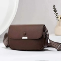 Brown lychee leather crossbody bag with wide patterned strap on white background - Coffee