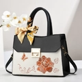 Elegante bolso bordado en blanco y negro con motivos florais y cierre de G dorado - Estilo Bordado / Negro Bordado