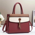 Detail of color-block tote bag featuring lychee grain texture and knot decoration - 28x11x22cm / Red