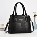 Elegante borsa a secchiello in pelle patchwork nera con manici e tracolla regolabile - Nero
