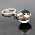 Macro shot of double-sided glass ball keychain with Christmas santa and gift box scenes - Jy007353-12