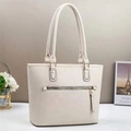 Detail showing the cream bucket tote bag with textured leather and metal zipper pocket - Off White