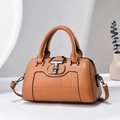 Detail of a brown plaid tote bag with silver T-shaped metal lock and black edging - Earthy Yellow