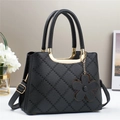 Quilted black tote bag with gold U-shaped handles and a delicate flower pendant - Black