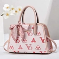 Detail of floral printed handbag with decorative pink scarf and golden metal hardware - Pink