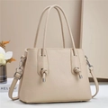 Close-up of beige lychee grain leather tote bag with elegant side knots and shoulder strap - L28 W12 H20 / Khaki