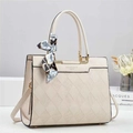 Detail of quilted beige bucket bag with gold hardware and a floral scarf tied to handle - Off White