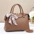 Detail of brown lychee leather handbag with golden zipper and heart pattern silk scarf - Dark Khaki