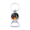 Metal Bigfoot and Alien keychain bottle opener with colorful camping scene illustration - Bigfoot And Alien Campfire Picnic (JY007427-1)