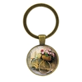 Macro detail of bronze keychain with vintage bicycle and floral glass cabochon pendant - Pink Flower Basket Art Sketch Pattern (JY007497-13)