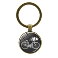 Macro detail of bronze vintage bicycle and flower basket motif under glass dome - Jy007497-12