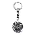 Detail of vintage bicycle keychain with silver crescent moon hollow pattern and floral pendant - Black Base White Bike Floral Style (JY007502-12)