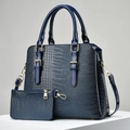Detail of dark blue crocodile pattern tote bag with gold hardware and small pouch - Blue