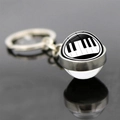 Macro detail of music themed keychain with piano keys pattern inside a glass ball charm - Jy007522-11
