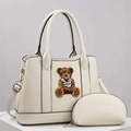 Detail of off-white shoulder bag with textured leather and plush bear embroidery - Off White