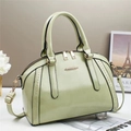 Chic pistachio green leather Boston bag with elegant gold hardware and top handles - Green
